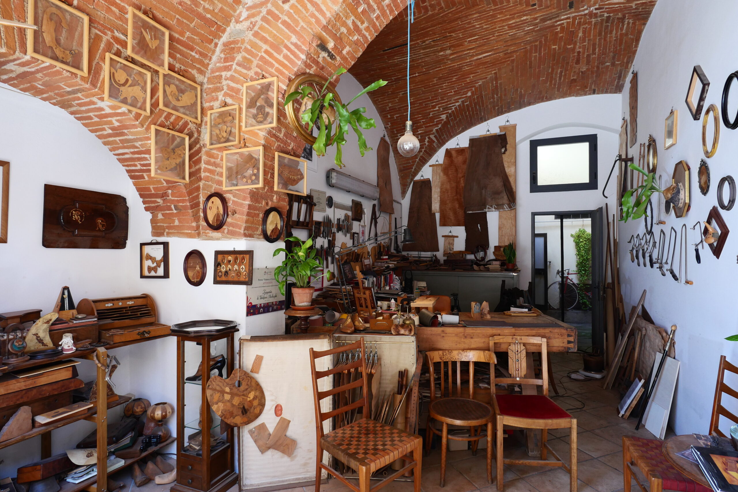 Workshop overview: benches, tools, and materials organized for long-term continuity